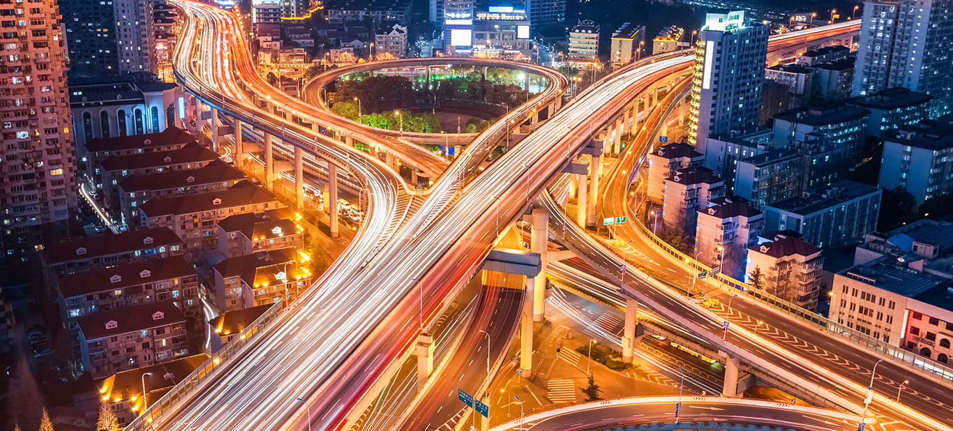 highway at sunset with light trails